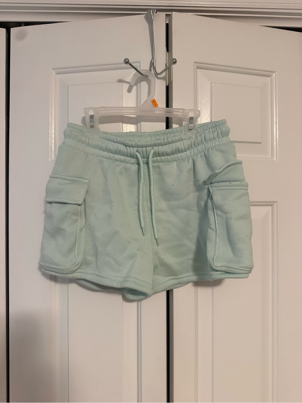 Light green cargo sweatshorts with pockets and drawstring waist